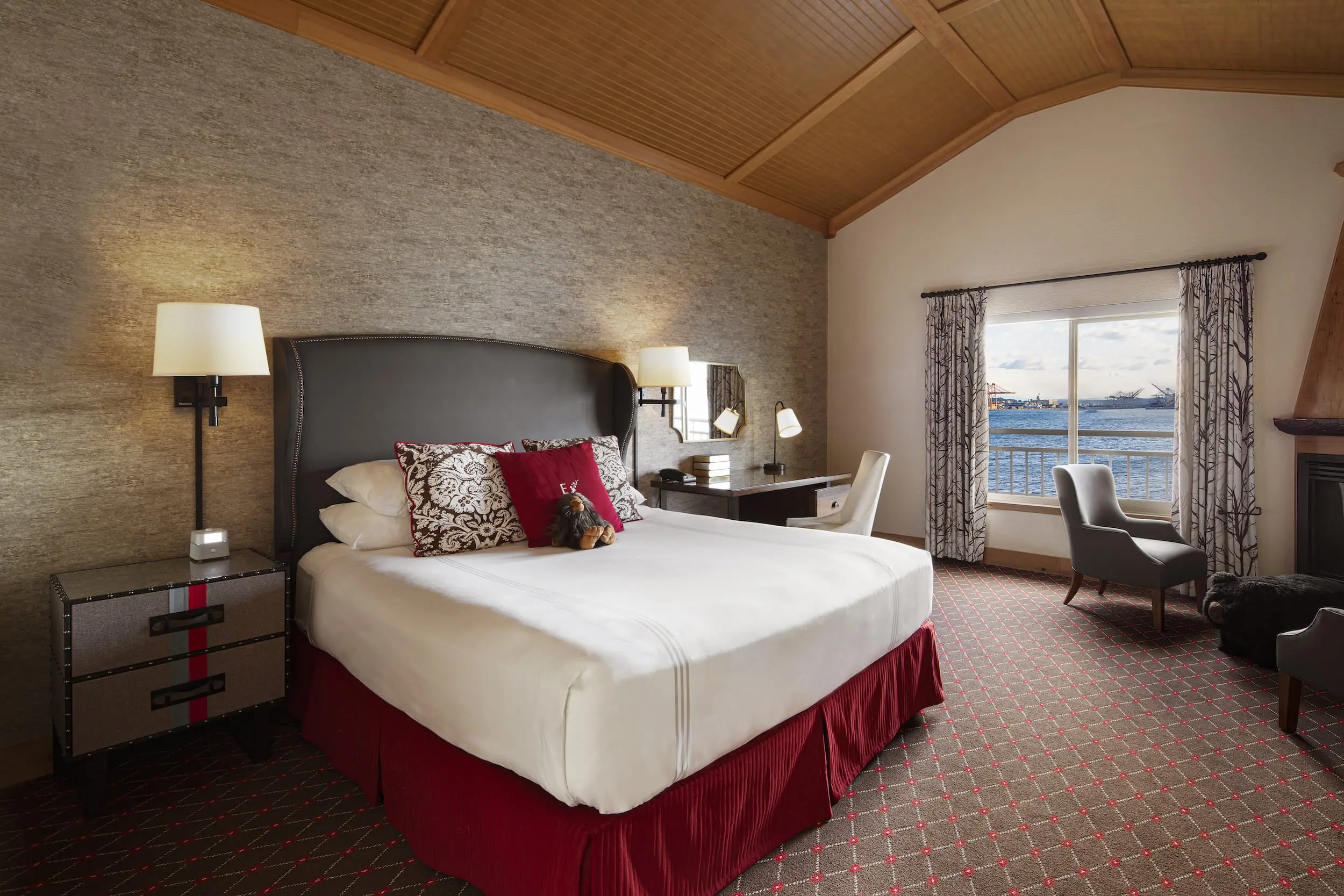 A king bed room with a balcony over looking the water at Edgewater