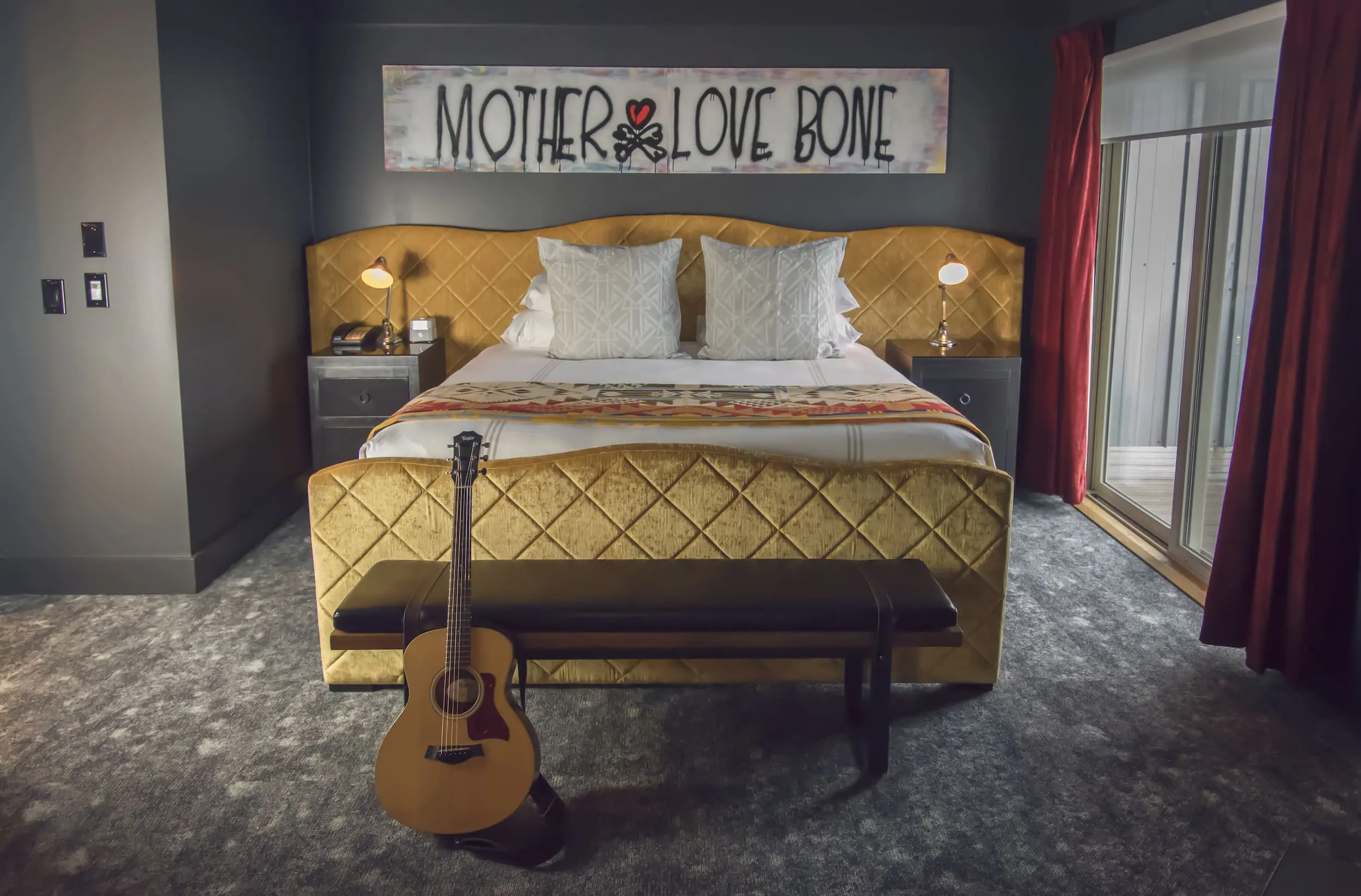 A pearl Jam inspired room with an acoustic guitar at Edgewater