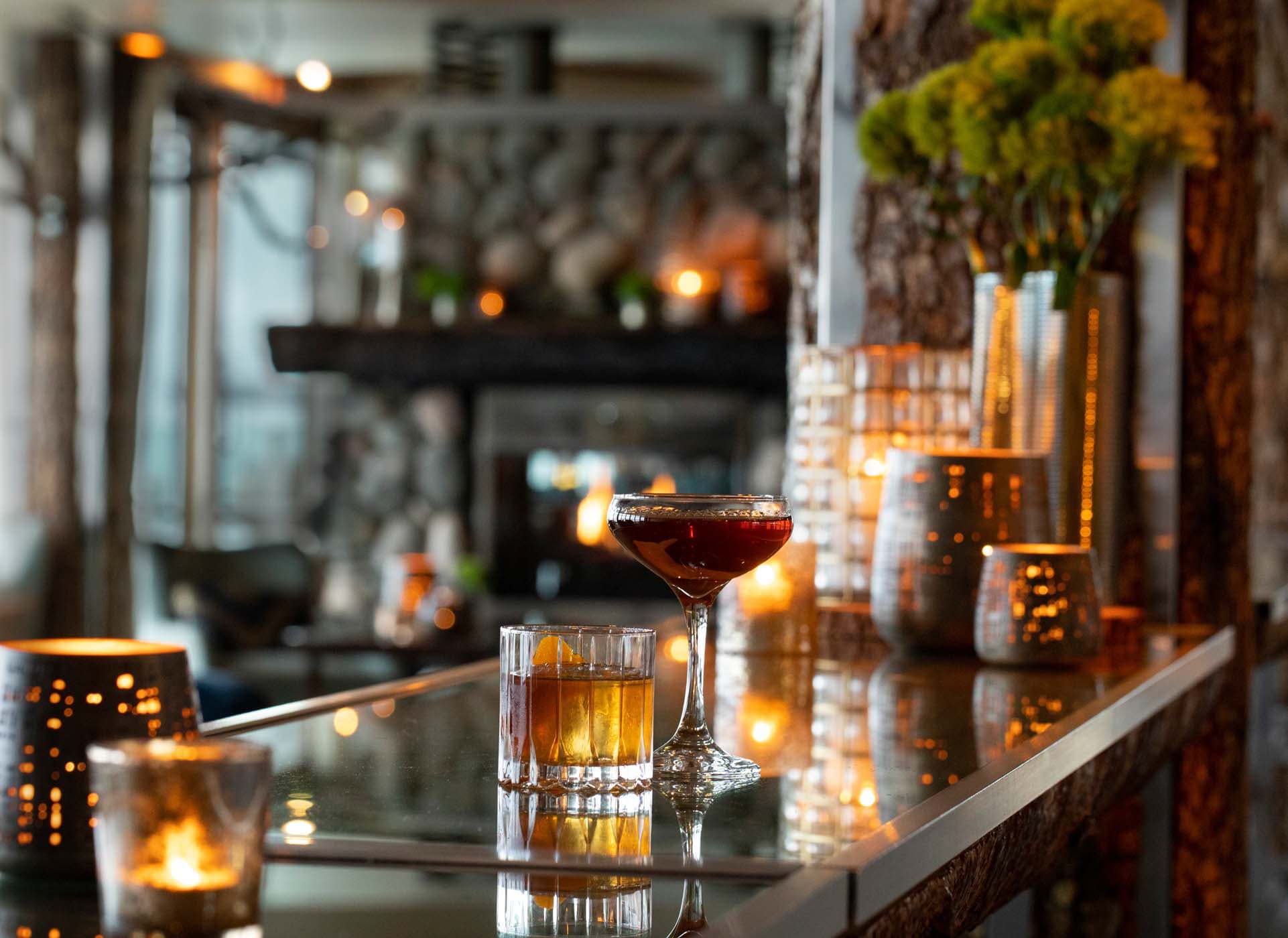 Two cocktails resting on the bar at Edgewater