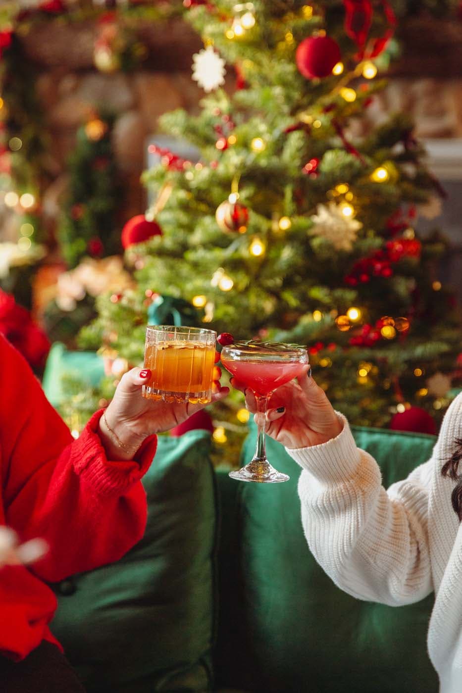 The lobby bar decorated for Christmas and two people having festive cocktails