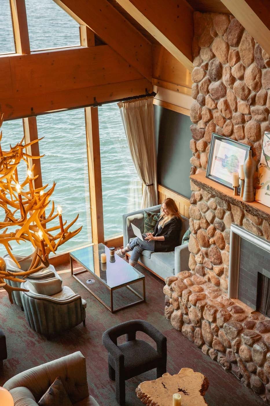 A woman using her laptop in the lobby of Edgewater