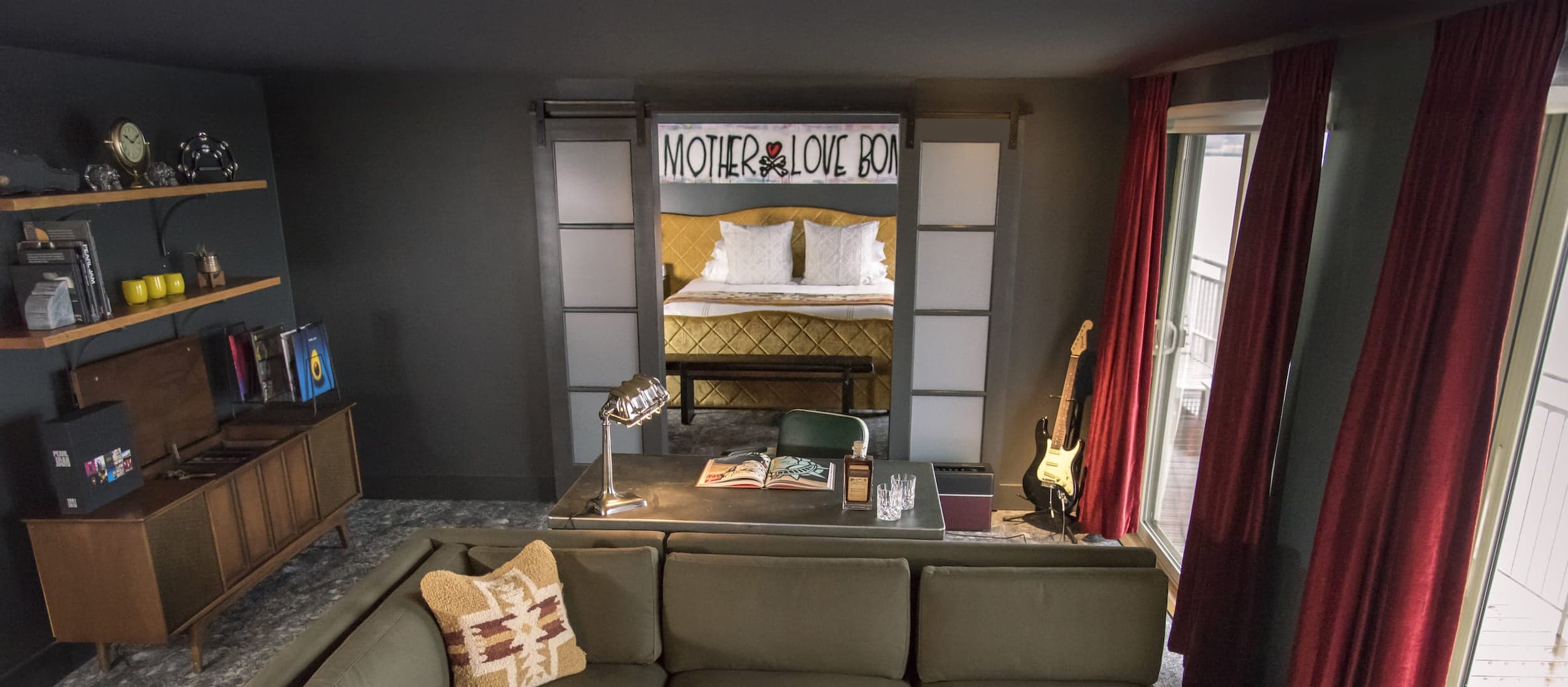 The living area of the Pearl Jam Suite at Edgewater with a view to the room