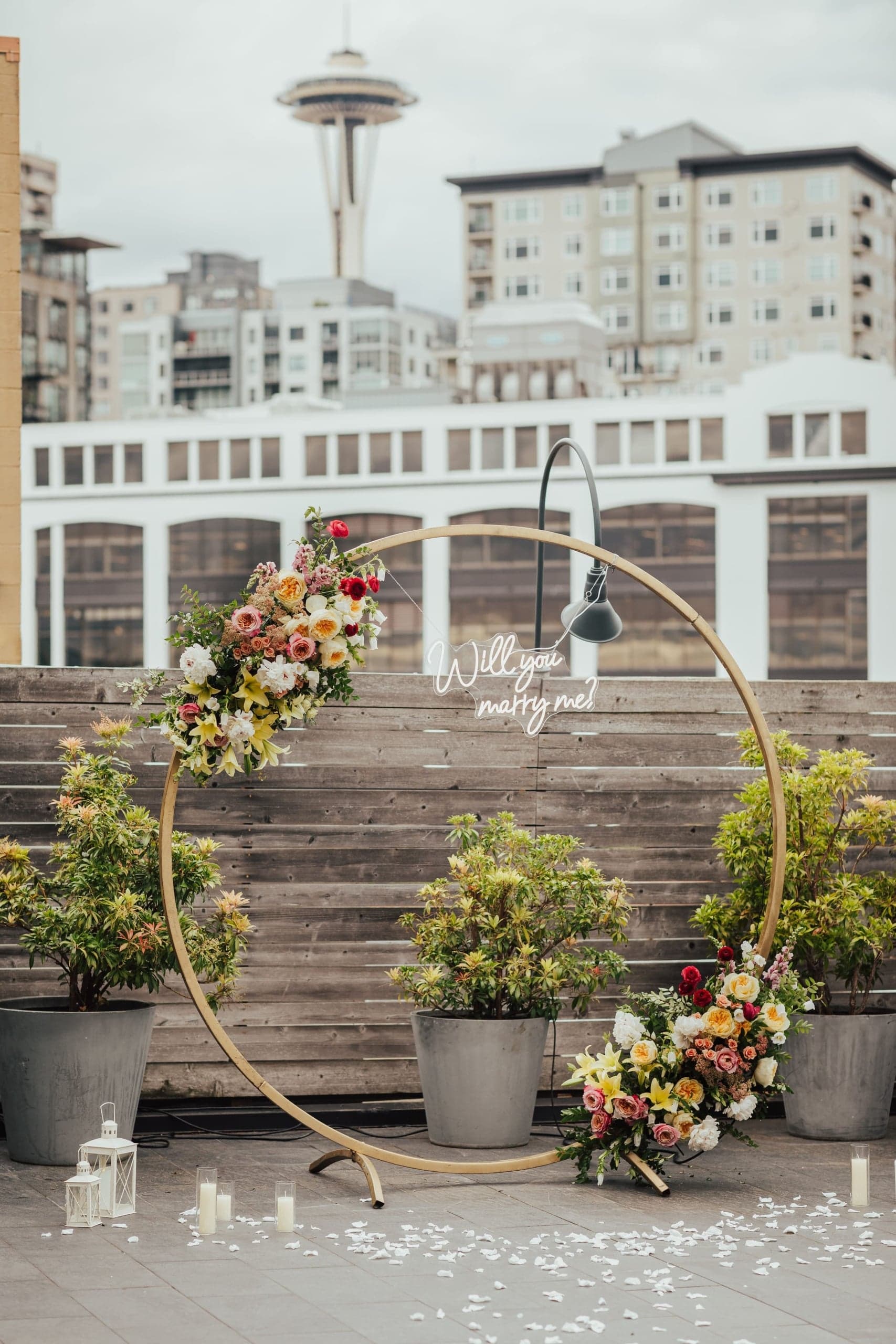 Beautiful wedding decor including candles, flowers and a Seattle backdrop at Edgewater