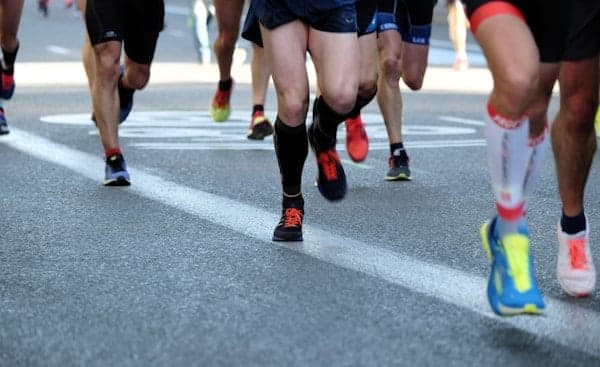 A bunch of marathoners feet during a marathon