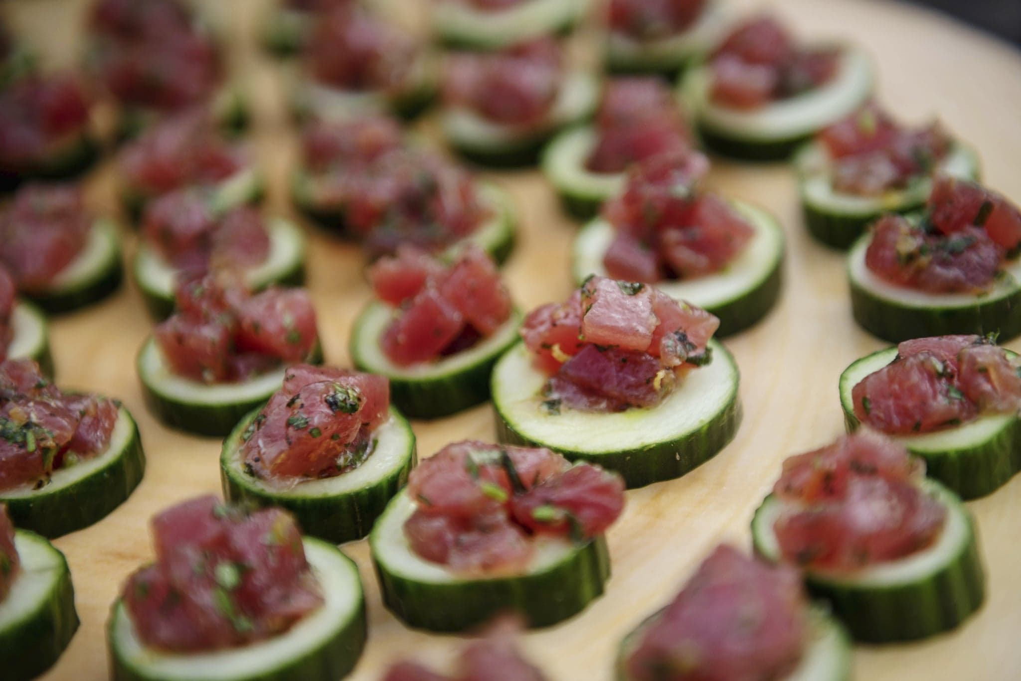 tuna tartare on cucumber discs for catering an event